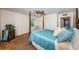 Cozy bedroom featuring a four-poster bed, neutral walls and complementary brown carpeting at 841 4Th N Ave # 21, St Petersburg, FL 33701
