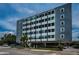 Exterior daytime view of Suncoast Towers condo building with modern design and well-maintained surroundings at 841 4Th N Ave # 21, St Petersburg, FL 33701