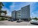 Daytime angle shot showcasing the condo building's architecture, parking, and surrounding landscape at 841 4Th N Ave # 21, St Petersburg, FL 33701