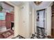 Hallway with access to the bathroom with vintage tile and features a black and white patterned floor at 841 4Th N Ave # 21, St Petersburg, FL 33701