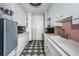 Charming kitchen featuring a vintage black and white tile floor and ample storage at 841 4Th N Ave # 21, St Petersburg, FL 33701