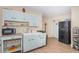 Functional kitchen with basic appliances and ample cabinet space for storage at 841 4Th N Ave # 21, St Petersburg, FL 33701