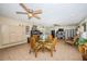 Spacious living area features tile floors, ceiling fans, and seating, connecting kitchen and dining at 841 4Th N Ave # 21, St Petersburg, FL 33701