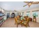 Comfortable living area featuring tile floors, ceiling fans, and a dining table near the kitchen at 841 4Th N Ave # 21, St Petersburg, FL 33701