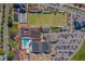 Overhead shot of clubhouse amenities, including lawn bowling and a pool, showcasing the community's recreational facilities at 913 Augusta Dr, Sun City Center, FL 33573