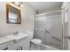 Bathroom featuring a vanity, toilet, and glass-enclosed shower with seat at 913 Augusta Dr, Sun City Center, FL 33573