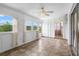 Bright Florida room with windows offering nice views, tiled floor, and ceiling fan at 913 Augusta Dr, Sun City Center, FL 33573