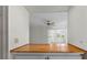 Bright kitchen featuring a wooden breakfast bar and view to the Florida room at 913 Augusta Dr, Sun City Center, FL 33573
