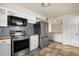 Modern kitchen with stainless steel appliances, stylish backsplash, and butcher block countertop at 913 Augusta Dr, Sun City Center, FL 33573
