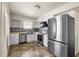 Updated kitchen with stainless steel appliances, butcher block counters, and backsplash at 913 Augusta Dr, Sun City Center, FL 33573