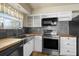 Kitchen featuring stainless steel appliances, butcher block countertops, and decorative backsplash at 913 Augusta Dr, Sun City Center, FL 33573