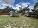 Wide shot of the Back Yard with trailer on the property at 9218 N 52Nd St, Tampa, FL 33617
