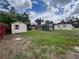 Spacious backyard featuring a shed, trailer, and plenty of room for outdoor activities at 9218 N 52Nd St, Tampa, FL 33617