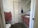Cozy bathroom featuring toilet and single sink vanity with ample lighting at 9218 N 52Nd St, Tampa, FL 33617