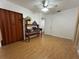 Bedroom with wood floors, closet and ceiling fan at 9218 N 52Nd St, Tampa, FL 33617