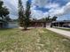 Charming single-story home with brick facade and a covered porch, complemented by a well-maintained front yard at 9218 N 52Nd St, Tampa, FL 33617