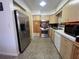 Functional kitchen featuring stainless steel appliances and wooden cabinets at 9218 N 52Nd St, Tampa, FL 33617