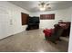 Cozy living room with a ceiling fan, a television, and comfortable seating at 9218 N 52Nd St, Tampa, FL 33617