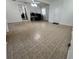 Expansive living room featuring neutral tile floors and seamless access to other areas at 9218 N 52Nd St, Tampa, FL 33617