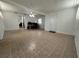 Bright living room featuring neutral flooring and white walls, offering a blank canvas for decor at 9218 N 52Nd St, Tampa, FL 33617