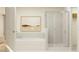 Modern bathroom featuring a soaking tub and a separate glass-enclosed shower at 9364 Bonita Mar Dr, Parrish, FL 34219