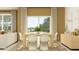 Welcoming dining room showcasing a modern dining set with a view of a backyard at 9364 Bonita Mar Dr, Parrish, FL 34219