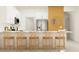 Modern kitchen featuring white cabinets, stainless steel appliances, and an island with seating at 9364 Bonita Mar Dr, Parrish, FL 34219