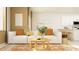 Bright living room featuring a comfortable sofa, stylish decor, and view of the kitchen at 9364 Bonita Mar Dr, Parrish, FL 34219