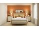 Warm bedroom showcasing a well-decorated bed, matching nightstands, and decorative lamps at 9364 Bonita Mar Dr, Parrish, FL 34219