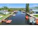 Picturesque aerial shot of a waterfront community with private boat docks and serene waterways at 9917 San Sierra Way, Port Richey, FL 34668