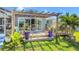 Charming backyard with a wooden deck and potted plants, perfect for relaxation and outdoor living at 9917 San Sierra Way, Port Richey, FL 34668