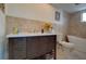 Bathroom featuring granite counters, stylish vanity, and a soaking tub at 9917 San Sierra Way, Port Richey, FL 34668