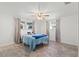 Bright bedroom with natural light, ceiling fan and tile flooring at 9917 San Sierra Way, Port Richey, FL 34668