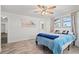 Bedroom featuring a ceiling fan, natural light and tile flooring at 9917 San Sierra Way, Port Richey, FL 34668