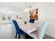 Elegant dining room features modern lighting and tile floors at 9917 San Sierra Way, Port Richey, FL 34668