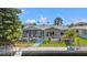 Charming waterfront home featuring a screened lanai, wooden deck, and private canal access at 9917 San Sierra Way, Port Richey, FL 34668