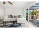 Comfortable living room with sliding doors leading to the outdoor patio at 9917 San Sierra Way, Port Richey, FL 34668