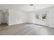 Bright, open living room featuring tile floors and double french doors at 9917 San Sierra Way, Port Richey, FL 34668