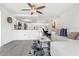 Bright living room featuring tile floors open to the kitchen and dining area at 9917 San Sierra Way, Port Richey, FL 34668