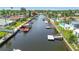 Scenic waterfront view of a canal lined with homes featuring private docks and boat lifts at 9917 San Sierra Way, Port Richey, FL 34668