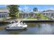 Beautiful waterfront property with private boat dock, perfect for boating and enjoying waterfront living at 9917 San Sierra Way, Port Richey, FL 34668