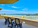 Wide balcony includes a seating arrangement to enjoy the stunning panoramic water views at 100 Bluff View Dr # 114C, Belleair Bluffs, FL 33770