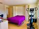 Multi-functional space with built-in storage, including a murphy bed and an exercise machine at 100 Bluff View Dr # 114C, Belleair Bluffs, FL 33770