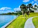 Lush grounds with a winding path, leading to picturesque views of the waterfront, blending nature and tranquility at 100 Bluff View Dr # 114C, Belleair Bluffs, FL 33770
