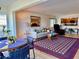 Inviting living room area with plush seating, stylish decor, and an open layout into the dining and kitchen spaces at 100 Bluff View Dr # 114C, Belleair Bluffs, FL 33770
