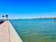Expansive waterfront view from the pier, overlooking the serene water, sailboats, and cityscape at 100 Bluff View Dr # 114C, Belleair Bluffs, FL 33770