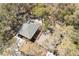 An aerial view of two homes with mature trees surrounding them, giving them a sense of seclusion at 10219 Huntley St, New Port Richey, FL 34654