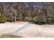 Community recreation area with sand volleyball court and covered picnic areas at 10219 Huntley St, New Port Richey, FL 34654