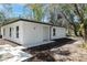 Charming exterior elevation of a modern home with new landscaping and walkway at 10219 Huntley St, New Port Richey, FL 34654