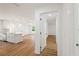 Open floor plan showcasing the kitchen, living room, and hallway, with natural light flowing through the spaces at 10219 Huntley St, New Port Richey, FL 34654